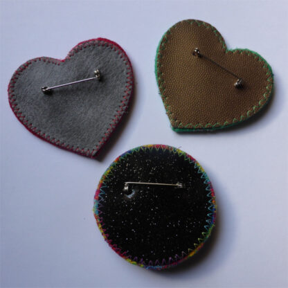 examples of the backs of brooches